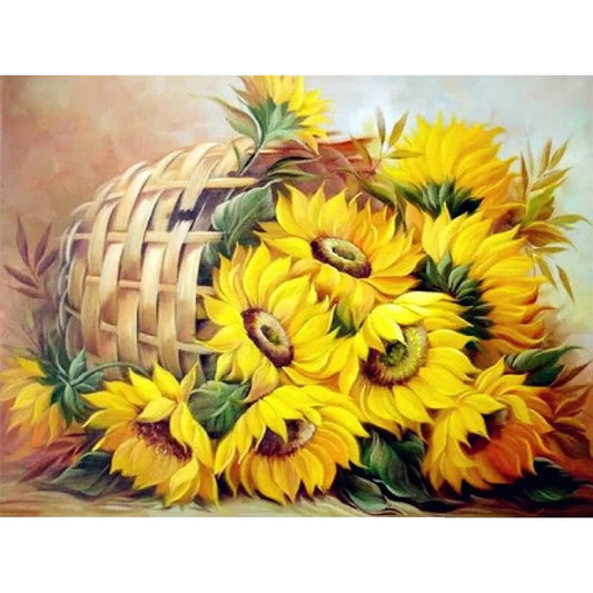 Artistieke weergave van een mand vol levendige zonnebloemen in een diamond painting ontwerp.