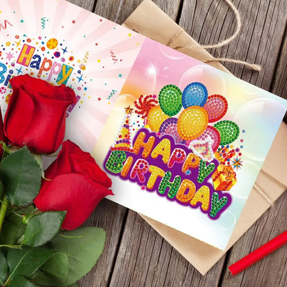 Fleurige verjaardagskaart met diamond painting van kleurrijke ballonnen en 'Happy Birthday' tekst, omlijst met rozen, voor een memorabele viering.